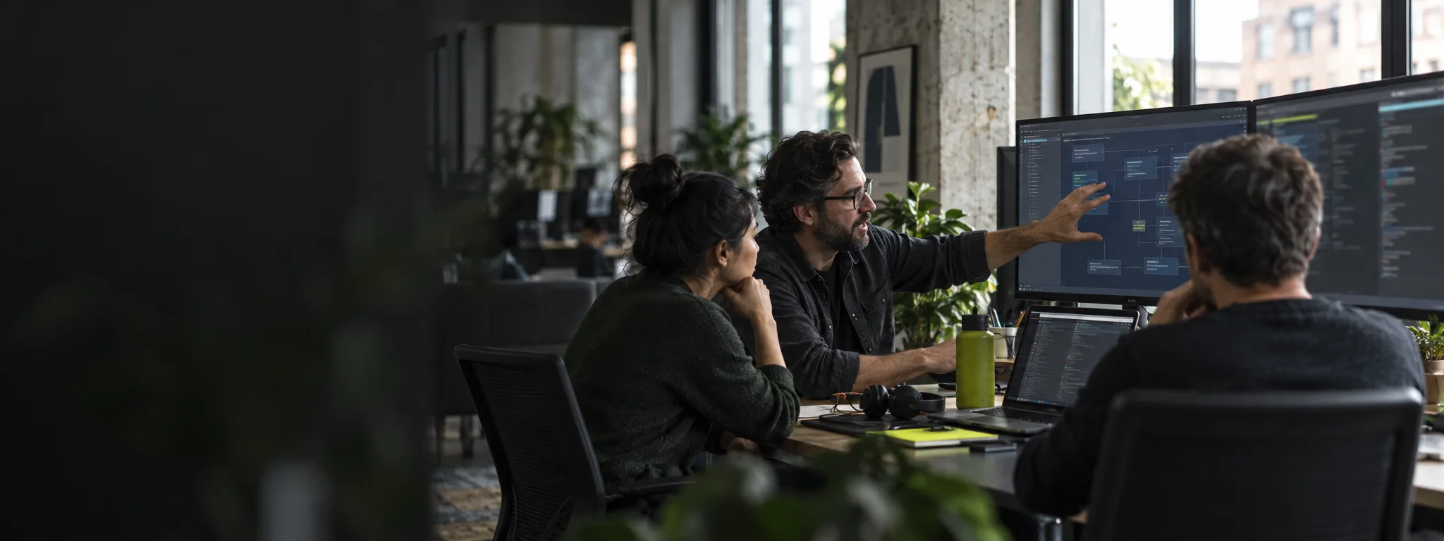 Software team reviewing a production system architecture together